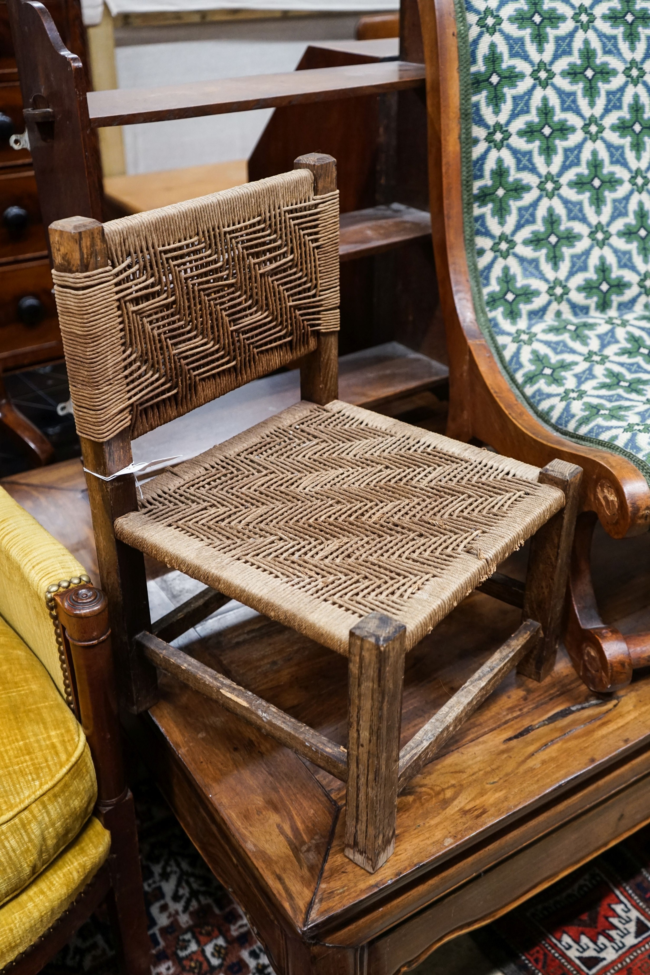 A late Victorian oak wall bracket, caned stool and chair